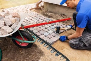 archer services man working on a backyard landscaping idea in Texas